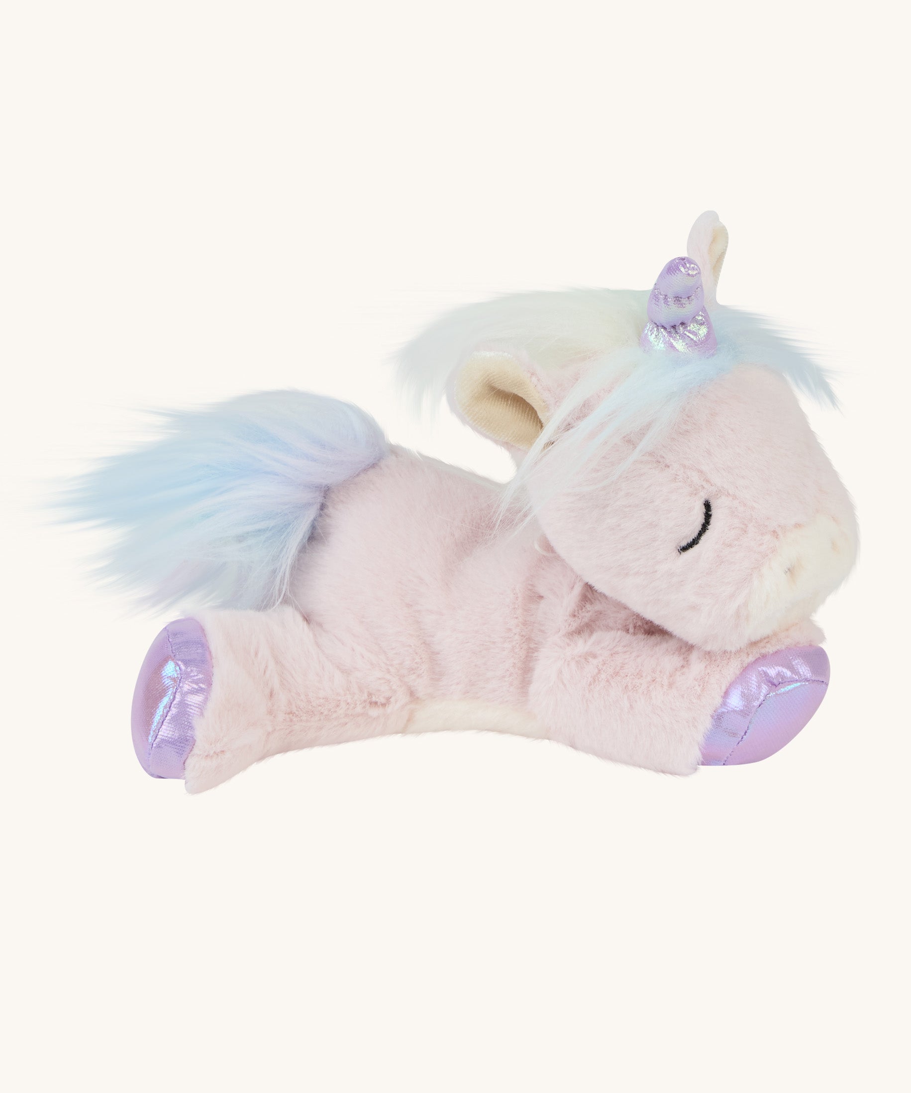 The pink unicorn toy laying down
