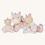 The Olli Ella pink unicorn collection posed together; a dinkum doll, a dinky doll, a dinkum unicorn, and a baby unicorn