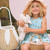 A child happily playing an egg hunt