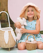 A child happily playing an egg hunt