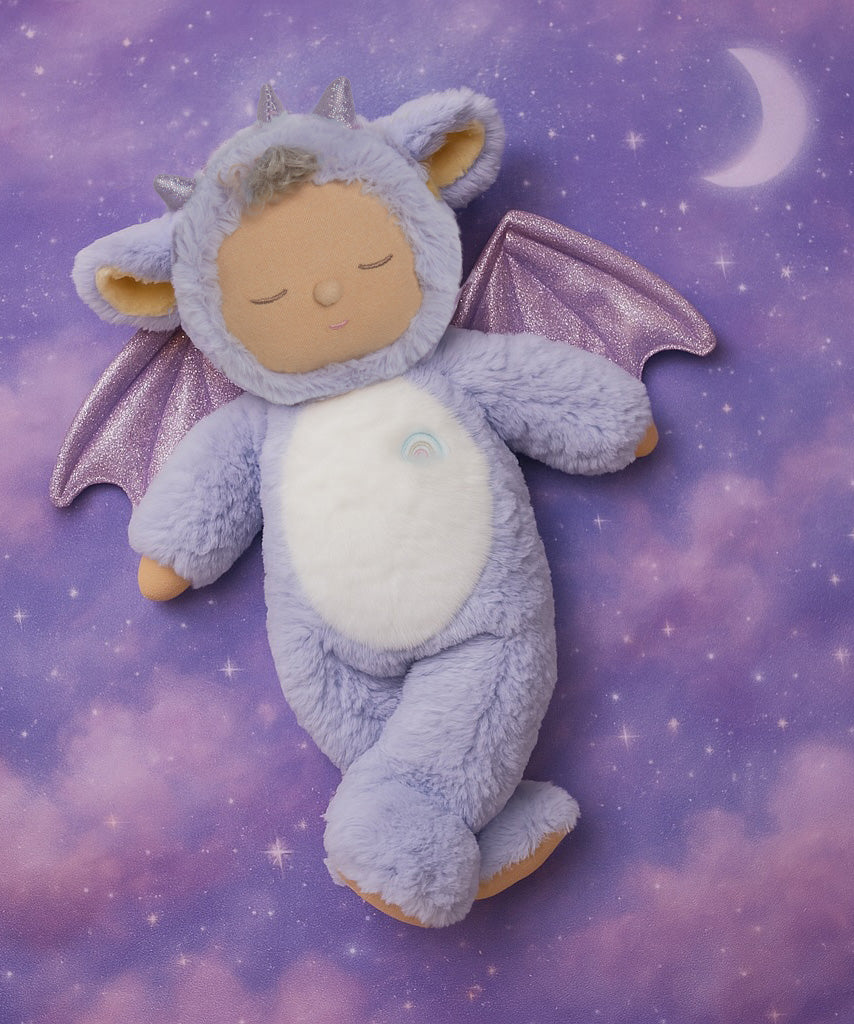Olli Ell Rory cozy dragon dinkum doll posing against a purple dreamy starry night background.