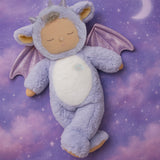 Olli Ell Rory cozy dragon dinkum doll posing against a purple dreamy starry night background.