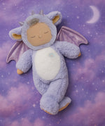 Olli Ell Rory cozy dragon dinkum doll posing against a purple dreamy starry night background.