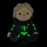 Olli Ella Scully Skeleton Dinky Dinkum Doll soft toy. The doll features glow in the dark bone details on the front along with a small embroidered rainbow on the chest. These soft toys are part of Olli Ella's Halloween collection available here at Babipur.