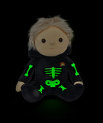 Olli Ella Scully Skeleton Dinky Dinkum Doll soft toy. The doll features glow in the dark bone details on the front along with a small embroidered rainbow on the chest. These soft toys are part of Olli Ella's Halloween collection available here at Babipur.