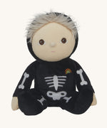 Olli Ella Scully Skeleton Dinky Dinkum Doll soft toy. The doll features glow in the dark bone details on the front along with a small embroidered rainbow on the chest. These soft toys are part of Olli Ella's Halloween collection available here at Babipur.