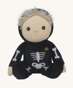 Olli Ella Scully Skeleton Dinky Dinkum Doll soft toy. The doll features glow in the dark bone details on the front along with a small embroidered rainbow on the chest. These soft toys are part of Olli Ella's Halloween collection available here at Babipur.