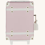 Olli Ella See-Ya Kids Travel Suitcase - Sorbet. A kids-sized suitcase for mini travellers in a beautiful light pink, white details with metal studs, on a cream background