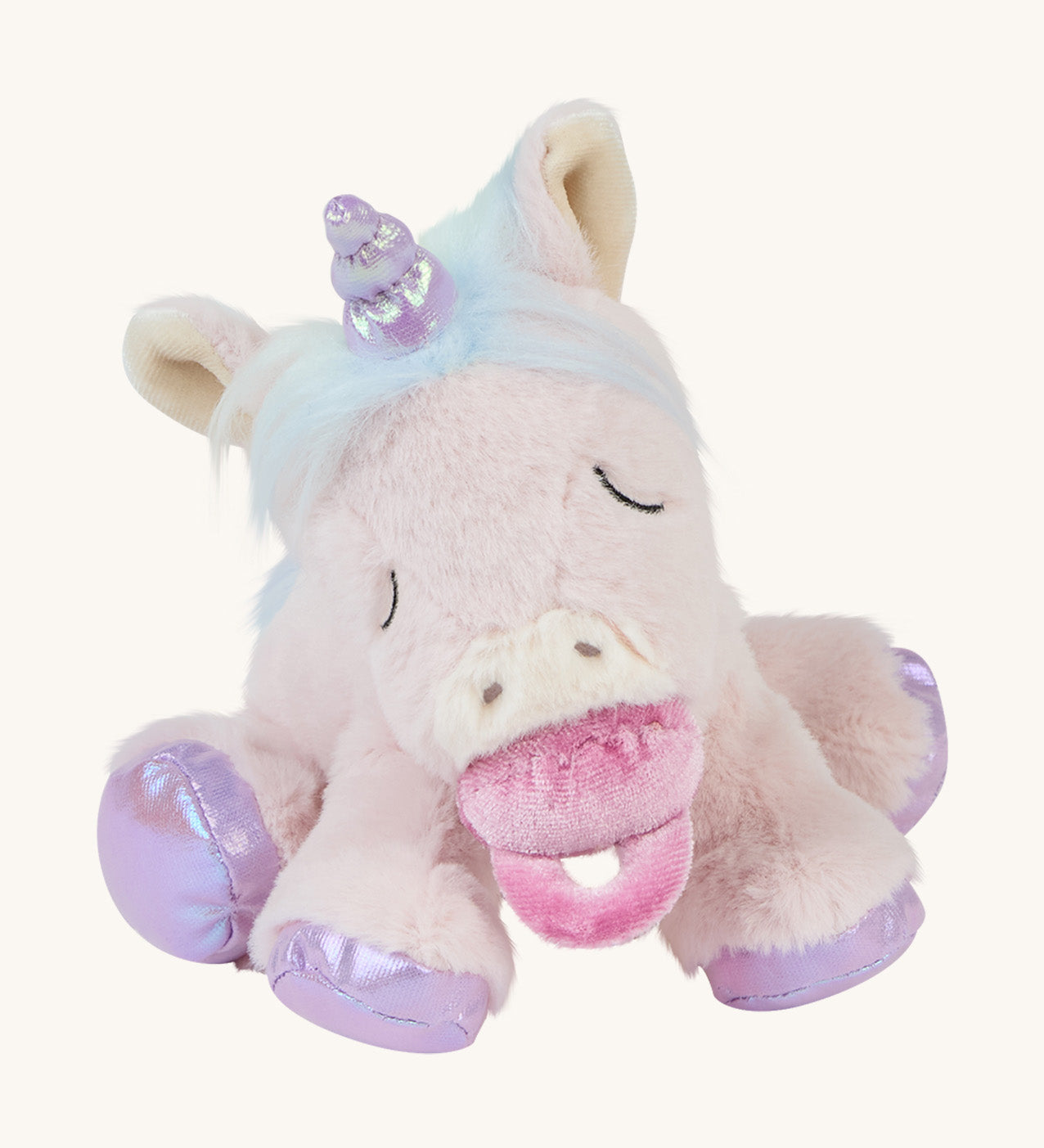 The baby unicorn toy sat down with a dummy