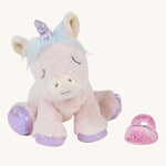 Olli Ella baby unicorn positioned to sit down, with its pink dummy beside it