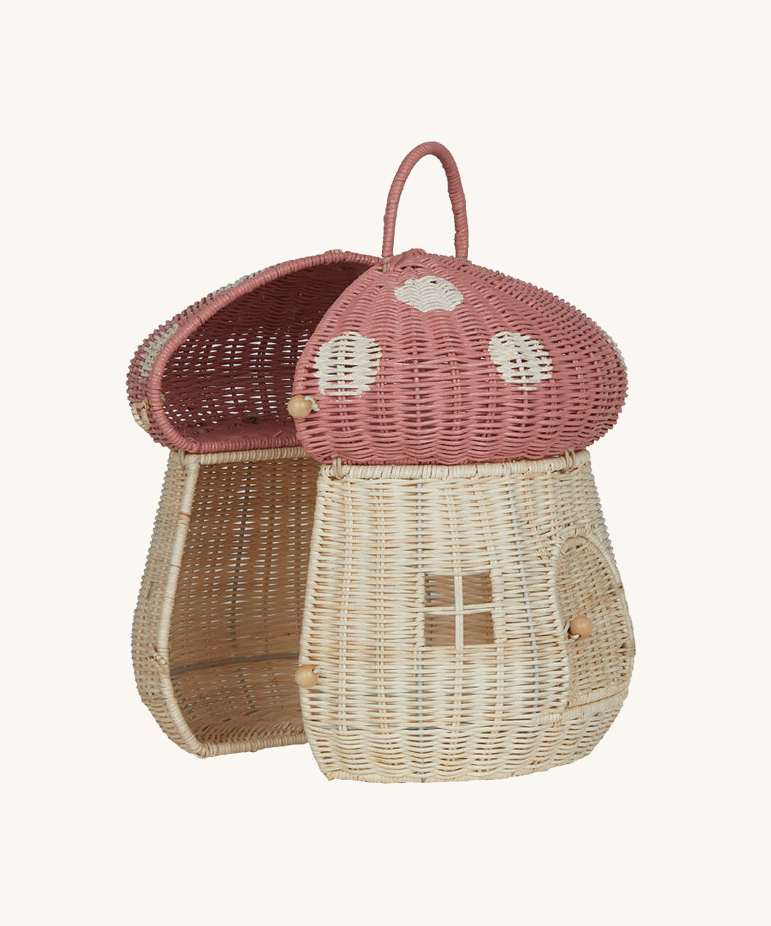 The Olli Ella Rattan Woven mushroom doll's house, with a pink spotty toadstool top, half opened.
