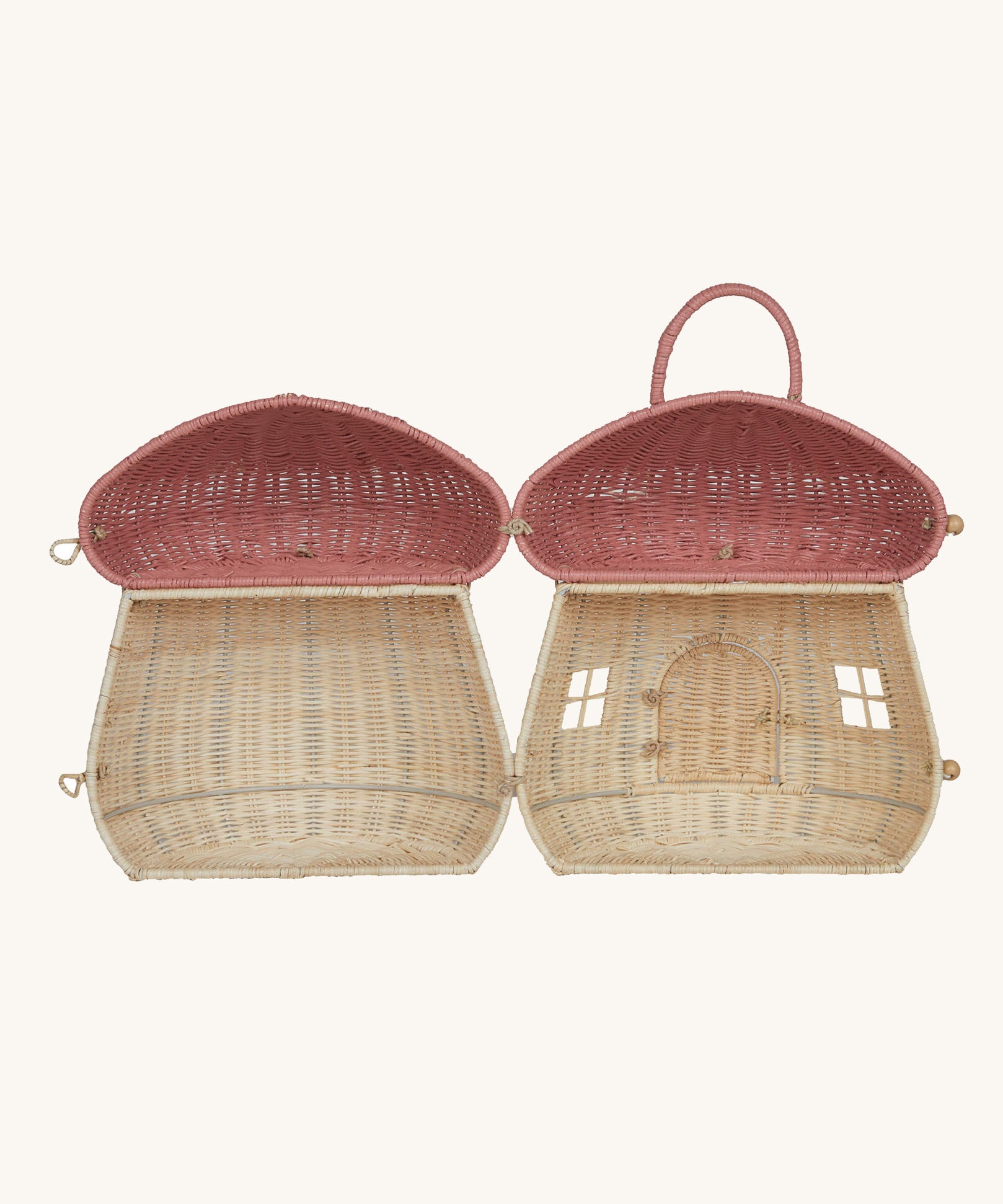 The Olli Ella Rattan Woven mushroom doll's house, with a pink spotty toadstool top, open fully to show inside.