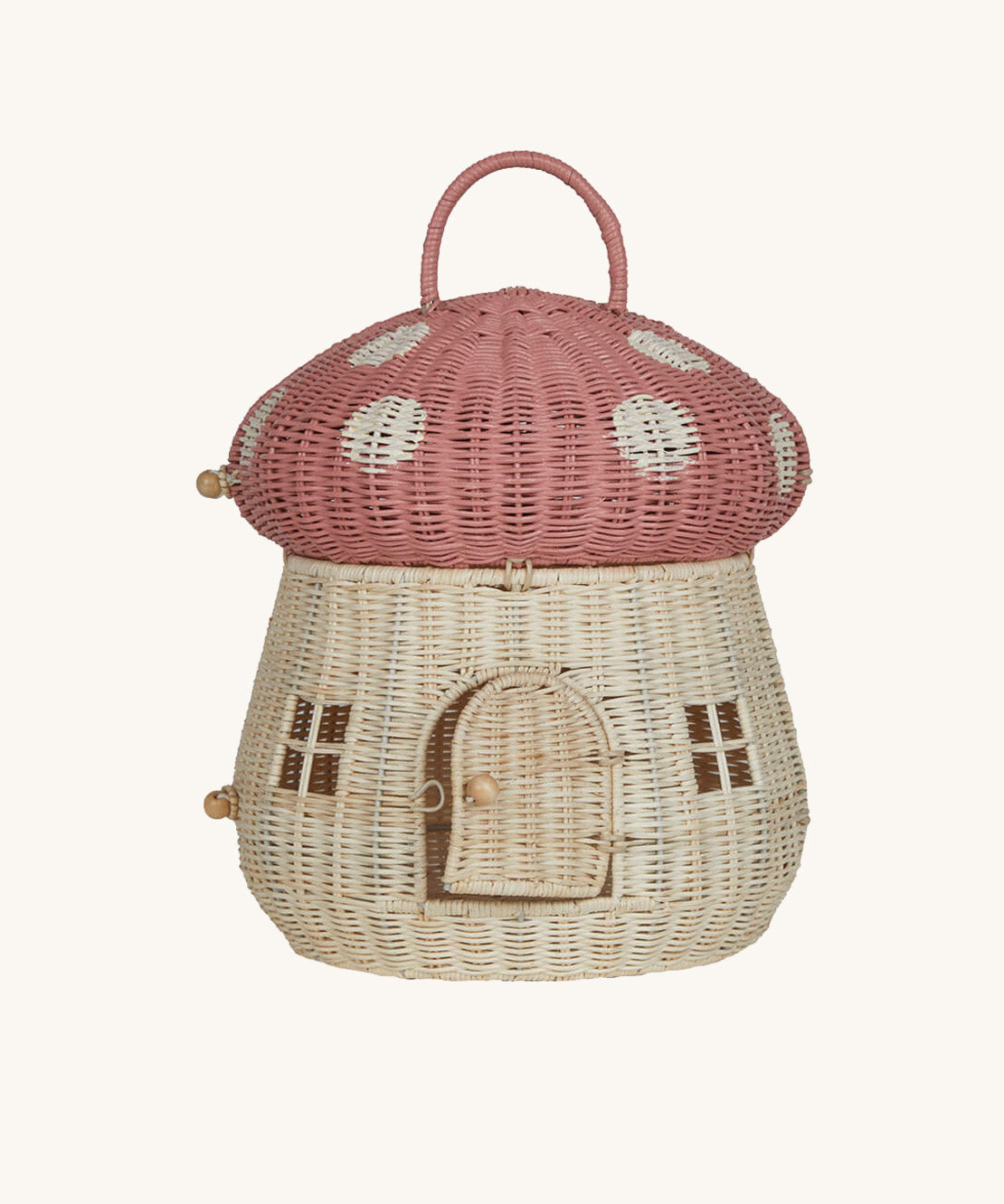 The Olli Ella Rattan Woven mushroom doll's house, with a pink spotty toadstool top and an opening door.