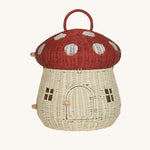 The Olli Ella Rattan Woven mushroom doll's house, with a red spotty toadstool top and an opening door. 