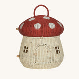 The Olli Ella Rattan Woven mushroom doll's house, with a red spotty toadstool top and an opening door. 