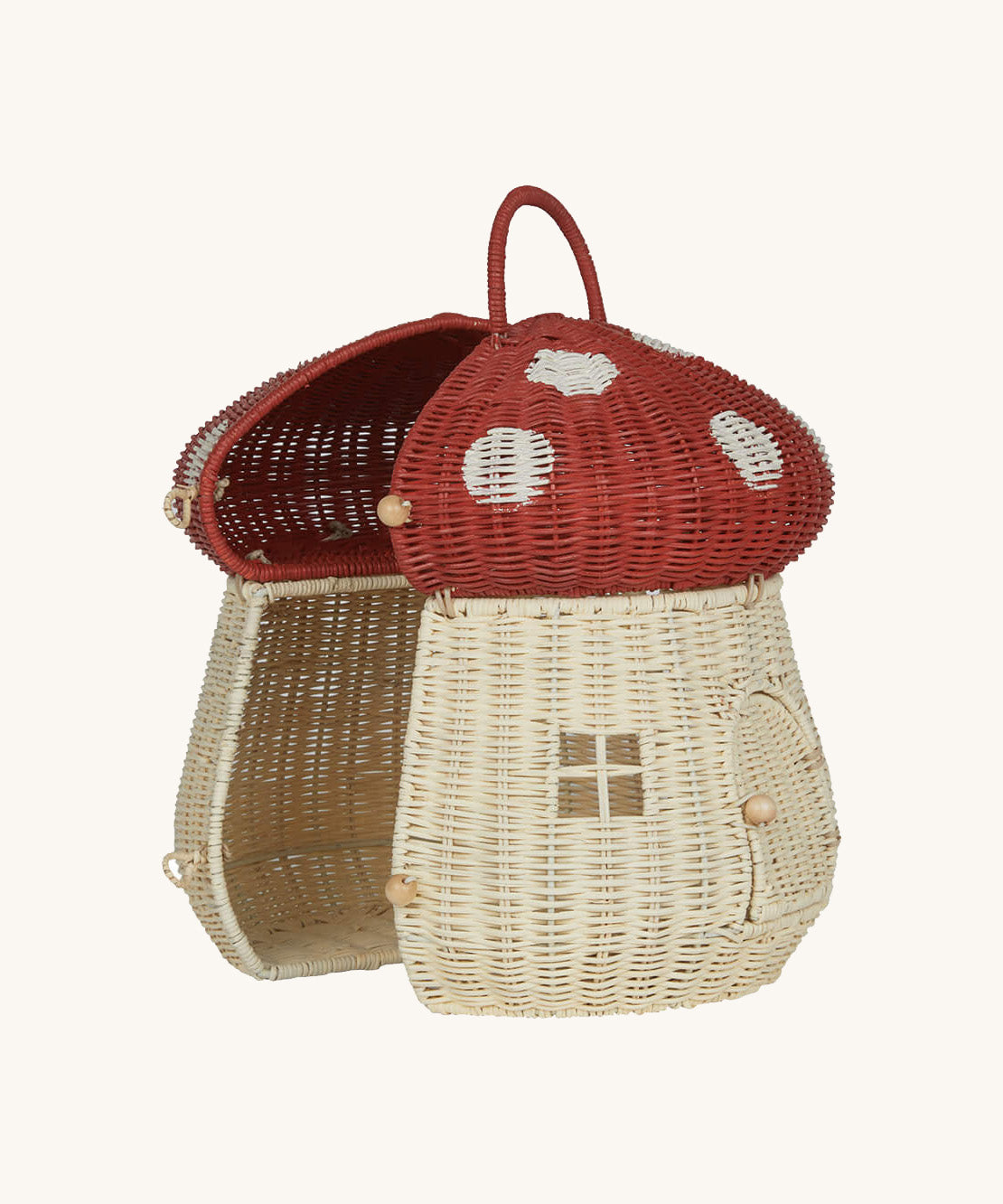 The Olli Ella Rattan Woven mushroom doll's house, with a red spotty toadstool top and an opening door. Halfway open to show the inside.