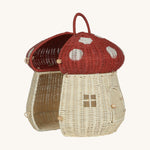 The Olli Ella Rattan Woven mushroom doll's house, with a red spotty toadstool top and an opening door. Halfway open to show the inside.