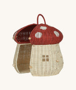 The Olli Ella Rattan Woven mushroom doll's house, with a red spotty toadstool top and an opening door. Halfway open to show the inside.