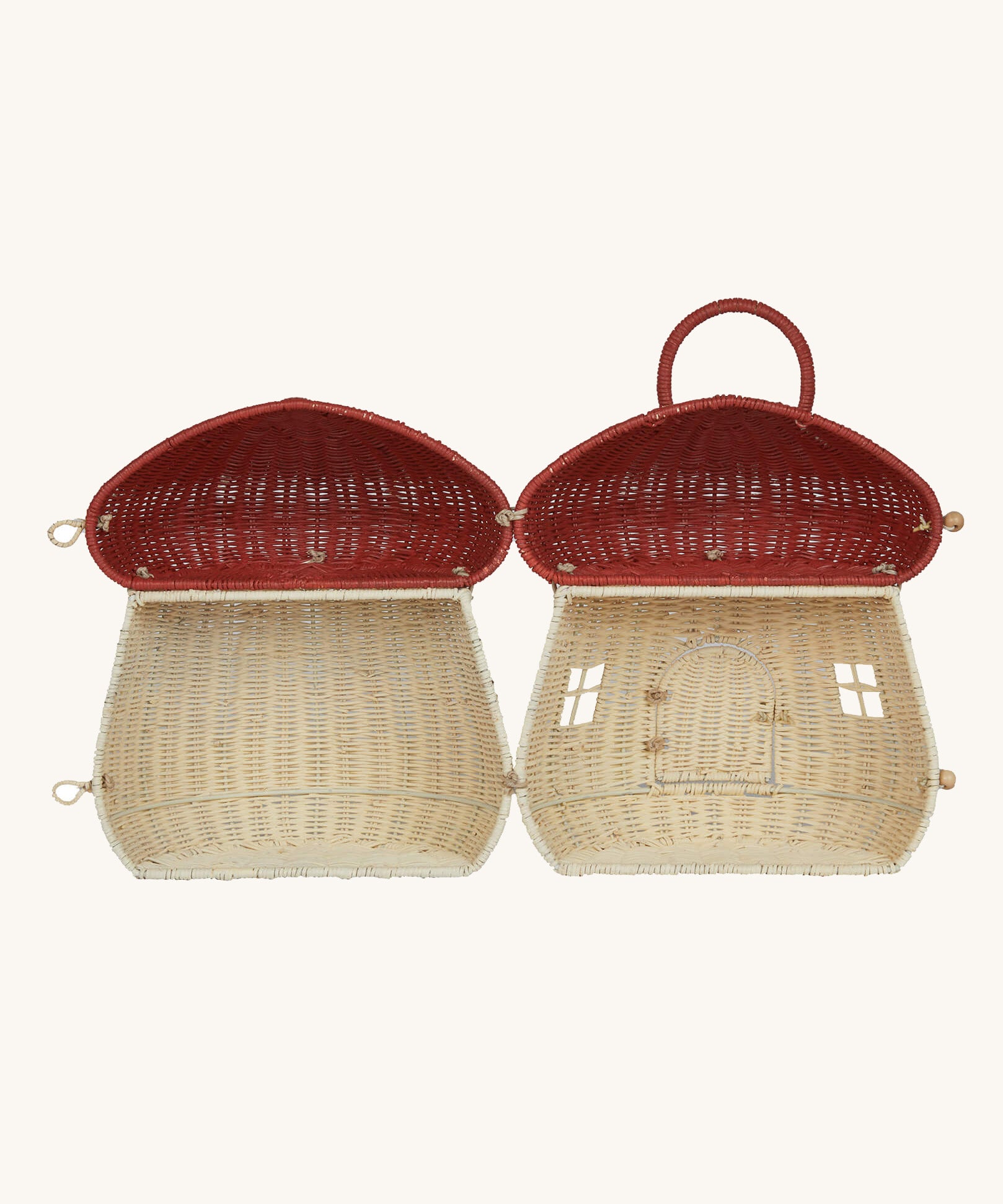 The Olli Ella Rattan Woven mushroom doll's house, with a red spotty toadstool top, opened all the way to show the inside.