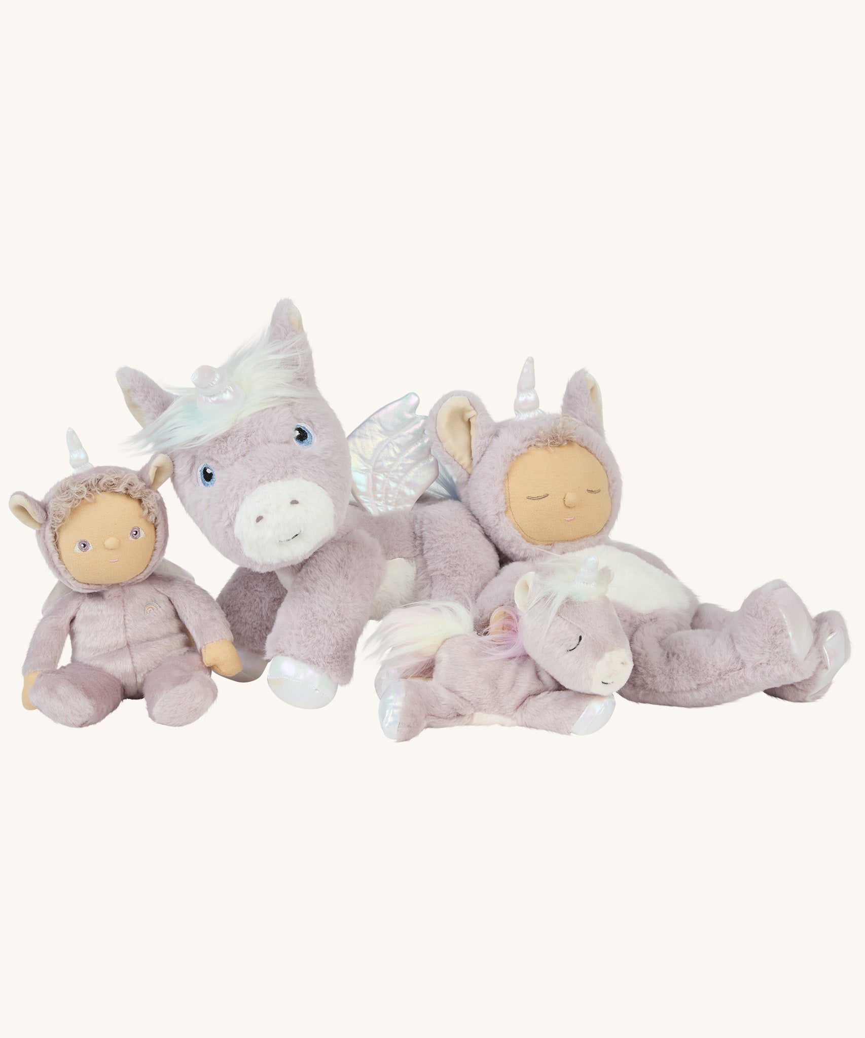 A picture of the Olli Ella unicorn collection toys posed together; a dinkum doll, a dinky doll, a dinkum unicorn, and a baby unicorn