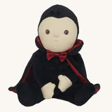 Olli Ella Vincent Vampire Dinky Dinkum doll. A soft vampire doll with a black cape with bat shaped glow in the dark details on the back. These soft toys are part of Olli Ella's Halloween collection available here at Babipur.