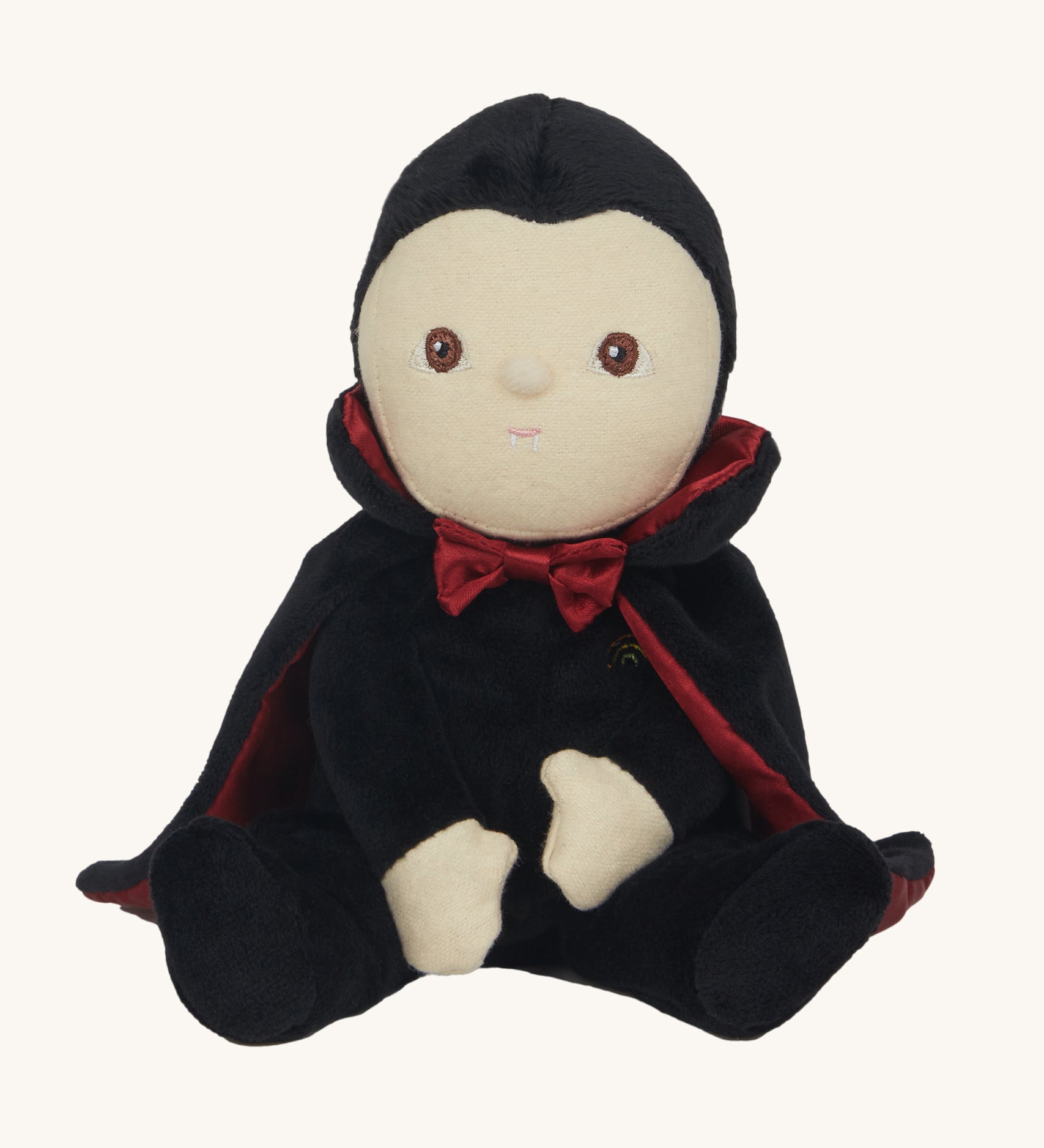 Olli Ella Vincent Vampire Dinky Dinkum doll. A soft vampire doll with a black cape with bat shaped glow in the dark details on the back. These soft toys are part of Olli Ella's Halloween collection available here at Babipur.