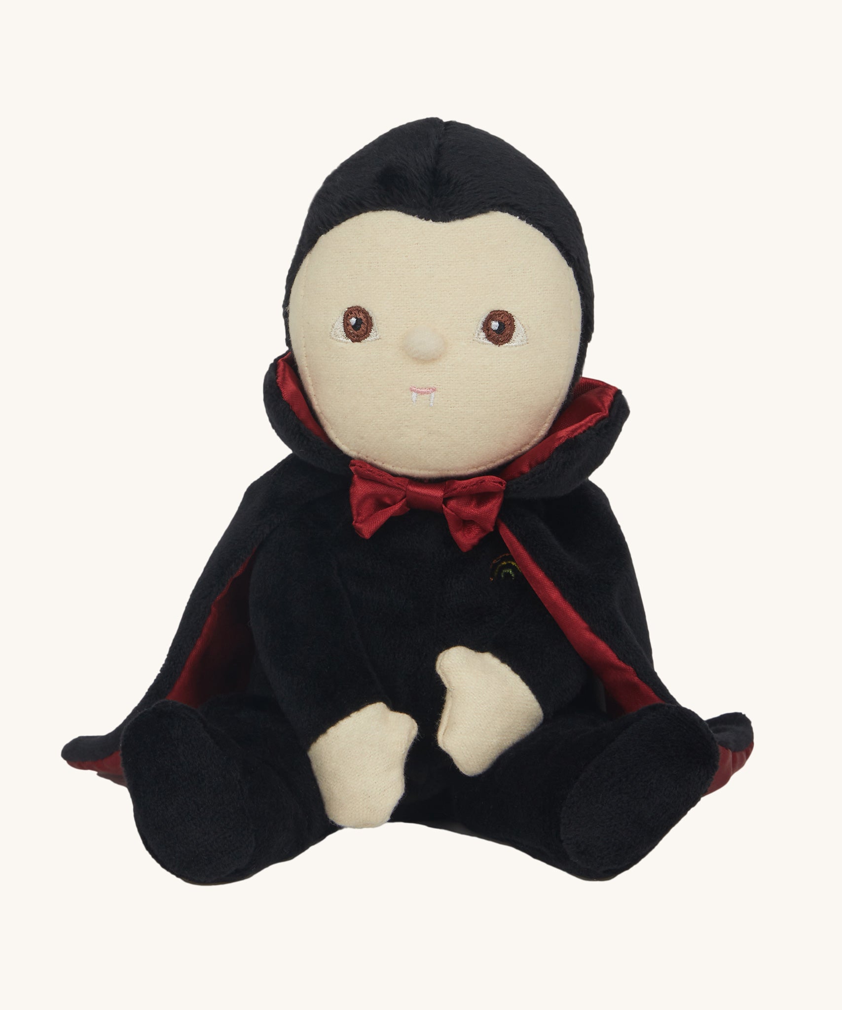 Olli Ella Vincent Vampire Dinky Dinkum doll. A soft vampire doll with a black cape with bat shaped glow in the dark details on the back. These soft toys are part of Olli Ella's Halloween collection available here at Babipur.