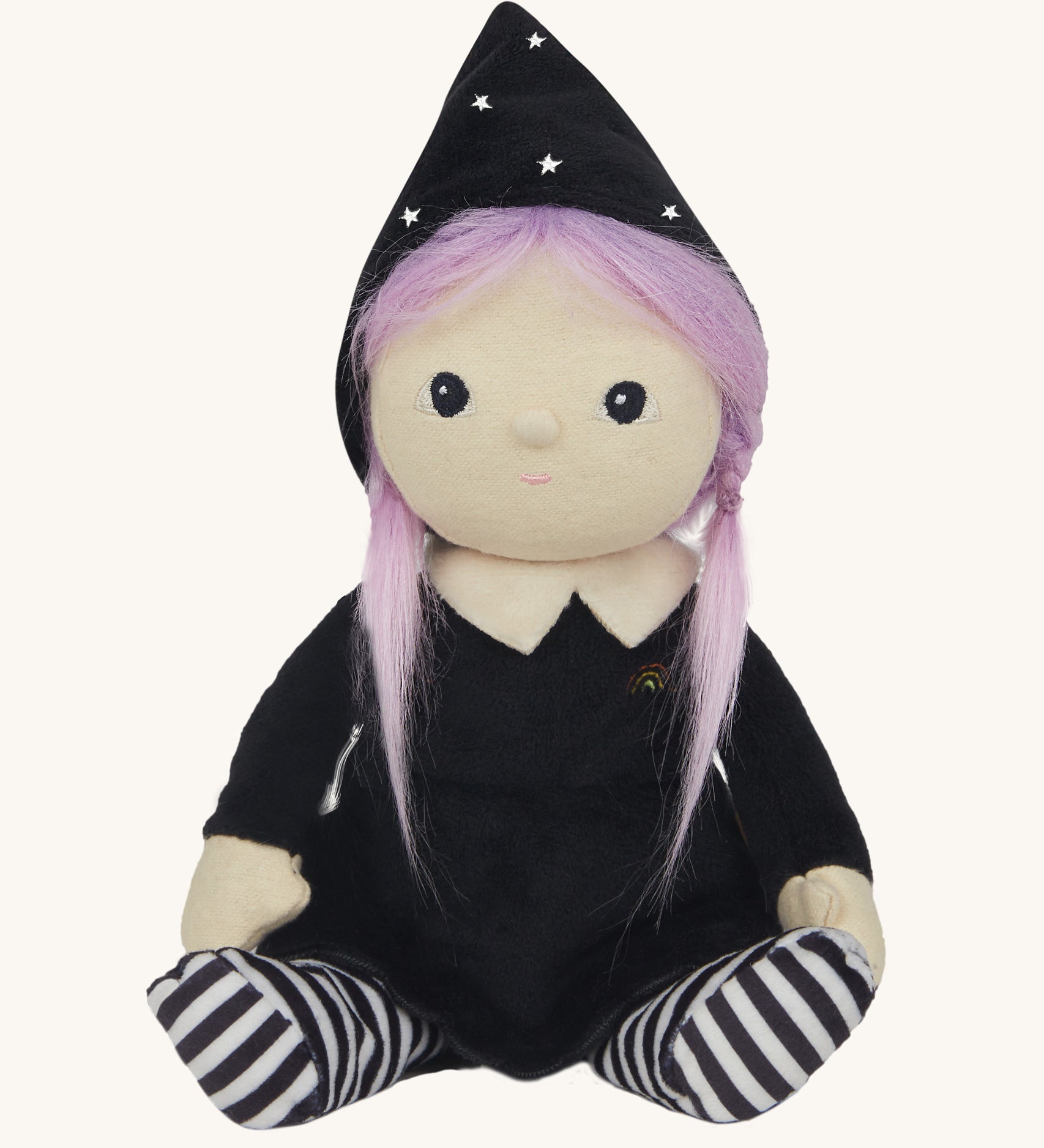 Olli Ella Willa Witch Dinky Dinkum Doll. A witch with a black outfit and matching hat with glow in the dark features on the striped tights, collar and stars on the hat. These soft toys are part of Olli Ella's Halloween collection available here at Babipur.