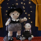 An Olli Ella endy witch dinkum doll standin next to an Olli Ella Willa Witch Dinky Dinkum Doll. These soft toys are part of Olli Ella's Halloween collection available here at Babipur.