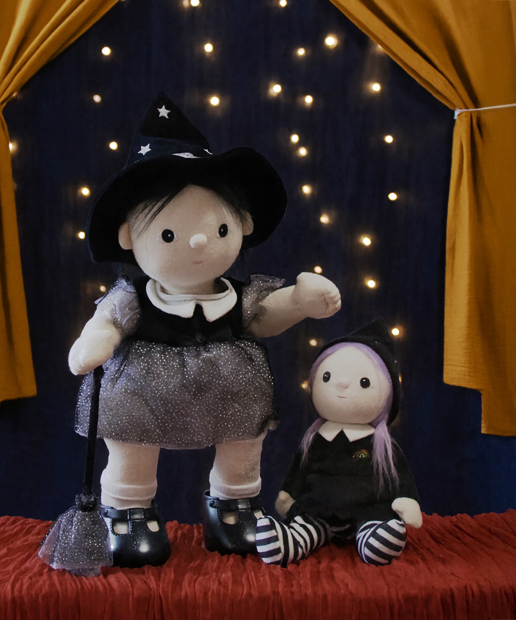 An Olli Ella endy witch dinkum doll standin next to an Olli Ella Willa Witch Dinky Dinkum Doll. These soft toys are part of Olli Ella's Halloween collection available here at Babipur.
