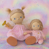 Olli Ella Willow dream dinkum doll sitting next to Fiona dinky dinkum doll against a dreamy background with confetti on the floor