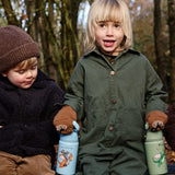 Children sitting on a wooden bench and holding a blue and green Zog One Green Bottle stainless steel bottles