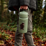Child walking in the forest and carrying a Stainless steel Green bottle with a Gruffalo character 