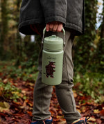 Child walking in the forest and carrying a Stainless steel Green bottle with a Gruffalo character 