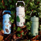 All 3 One Green Bottle collection bottles laid on a pike of autumn leaves showing the different Gruffalo characters