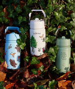 All 3 One Green Bottle collection bottles laid on a pike of autumn leaves showing the different Gruffalo characters