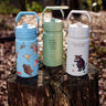 All 3 One Green Bottle collection bottles standing on a tree trunk showing the different Gruffalo characters