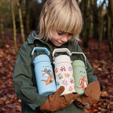 Child holding All 3 One Green Bottle collection bottles in the forest showing the different characters