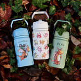 All 3 One Green Bottle collection bottles laid on a pike of autumn leaves showing the different Zog characters