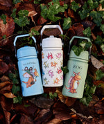 All 3 One Green Bottle collection bottles laid on a pike of autumn leaves showing the different Zog characters