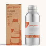 A bottle of the Georganics orange oil pulling mouthwash with the box