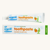 Organic Children Toothpaste Mandarin & Aloe Vera with Fluoride showing the tube next to the cardboard on a plain background. 