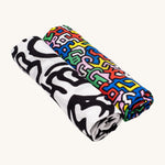 Etta Loves X Keith Haring Organic Cotton Baby Muslin Squares - 2 Pack, in 'Baby' and 'Brazil' print