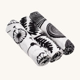 Etta Loves Organic Cotton Baby Muslin Squares 3 Pack - Plant, from left to right is Dandelion, Fern and Tree Ring, in striking black and white print