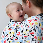 The Etta Loves Reversible Organic Cotton Muslin Blanket - Plant Print with black and white Ferns on one side