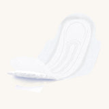 Individual open moderate flow pad on a cream background.