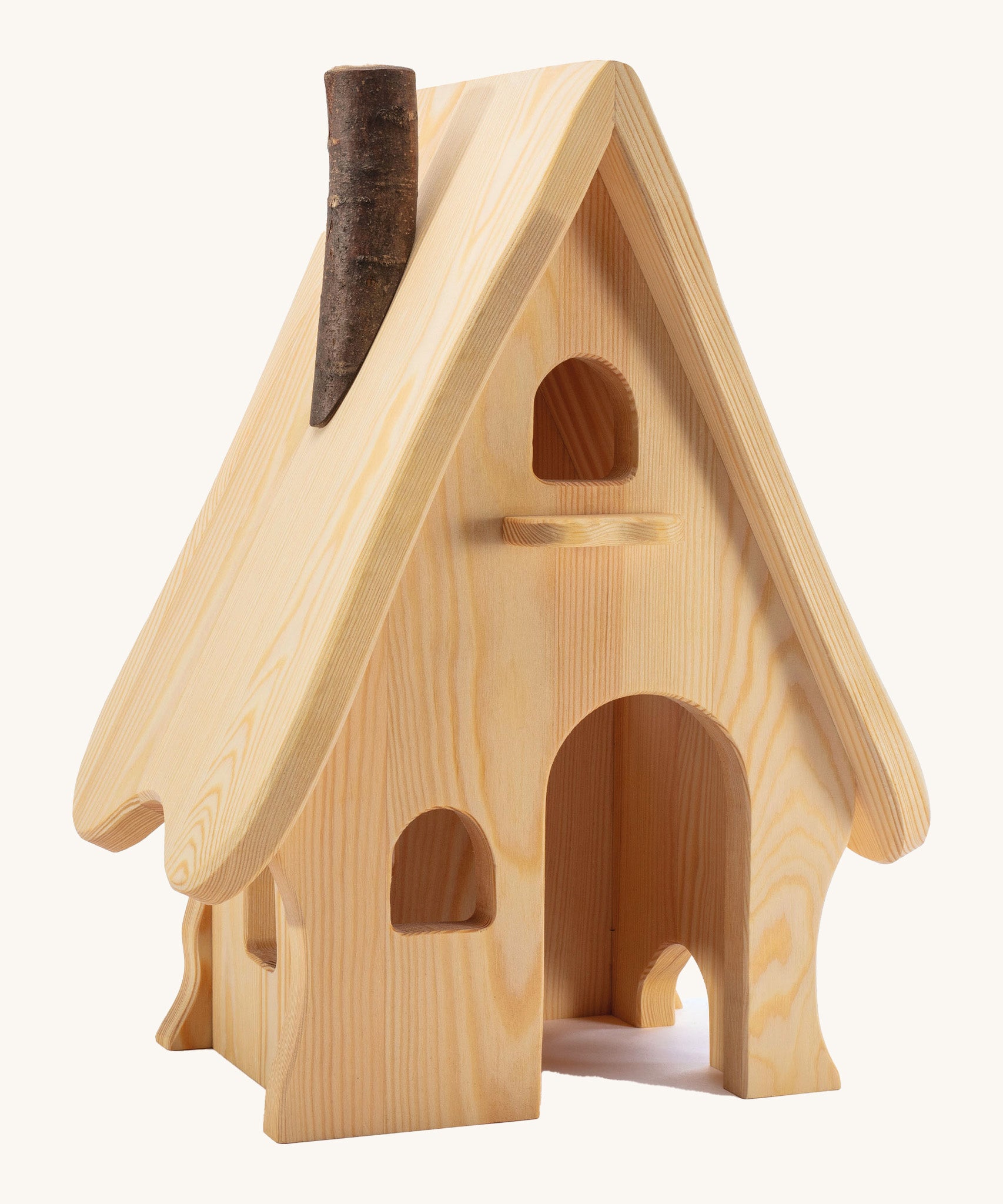 A wooden Ostheimer fairy tale dolls house on a cream background.