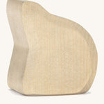 A wooden Ostheimer rock for the Ostheimer sitting mermaid on a cream background.