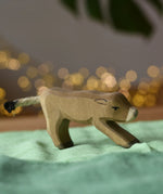 Ostheimer alp calf drinking placed on a green cotton play cloth.
