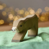 Ostheimer alp calf drinking placed on a green cotton play cloth.
